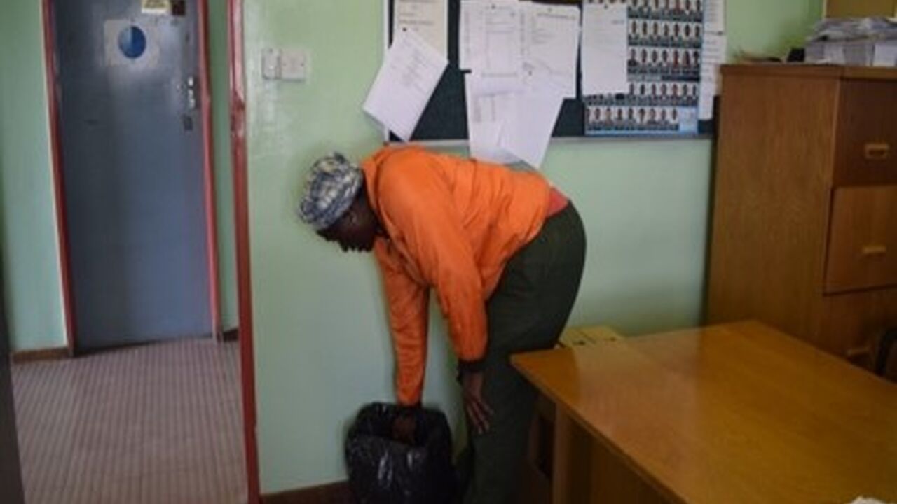 Female refuse collector Okavango